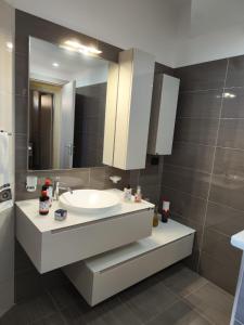 a bathroom with a sink and a mirror at Da Nella in Santo Stefano di Camastra +27 photos