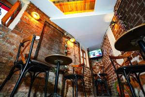 Μια τηλεόραση ή/και κέντρο ψυχαγωγίας στο Squit Suits Hotel +19 φωτογραφίες