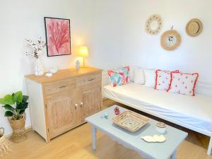 a living room with a couch and a table at Lemon Tree House, Golden Beach in Chrissi Akti