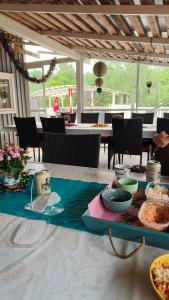 a table with plates of food on top of it at Kiinteistö Hetekka in Kouvola