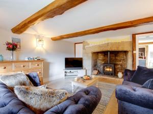 a living room with two couches and a fireplace at 3 Bed in Niton 93697 in Niton
