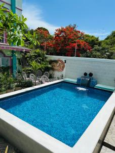 a swimming pool on the side of a building at The Quetzal in Cancún