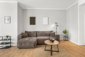 a living room with a couch and a table at Loft im Herzen von Paderborn in Paderborn
