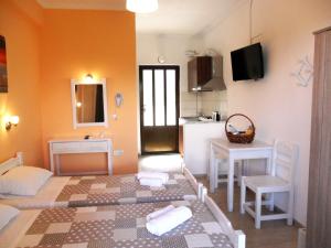 Postel nebo postele na pokoji v ubytování Marilena Apartments & Studios