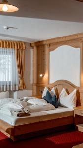 A bed or beds in a room at Garni La Ciasota 3s Még 37 kép