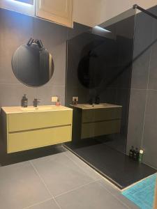a bathroom with two sinks and a mirror at RUDIAE Palace In Lecce in Lecce +141 photos