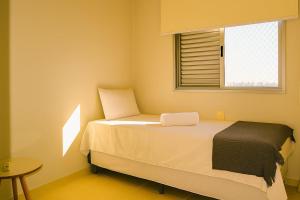 Ένα ή περισσότερα κρεβάτια σε δωμάτιο στο Shows no Serra Dourada. Tudo perto Jd. Goiás / 3Q/ 2 Gar