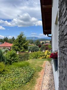 a view of a garden from the side of a house at U Králíčků in Vlcice