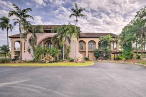 a large house with a road in front of it at Poolside Relaxation Resort Condo in Naples! in Naples