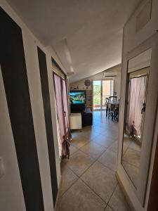 a hallway of a house with a living room at Attico Bellavista in Termoli