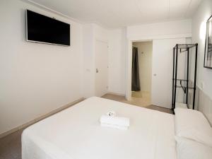 Postel nebo postele na pokoji v ubytování L'Hostalet GuestHouse