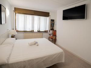 Postel nebo postele na pokoji v ubytování L'Hostalet GuestHouse