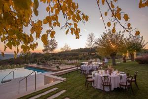 a table set up for a wedding in a garden at Tranquil Istria Estate Palazio Clai Winery 8 Bedrooms Spa & Heated Pool in Grožnjan