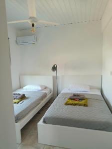 Ένα ή περισσότερα κρεβάτια σε δωμάτιο στο Casa Sea Breeze