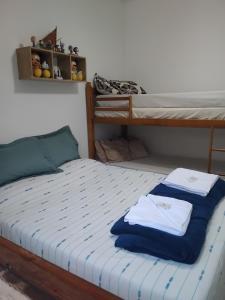 a bedroom with a bed with two bunk beds at Casa de Campo em Teresópolis in Teresópolis +68 photos