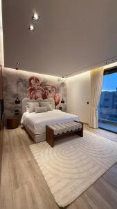 a bedroom with a large bed and a large window at Villa Talya in Marrakesh +24 photos