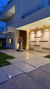 a building with a statue in front of it at Villa Talya in Marrakech +24 photos