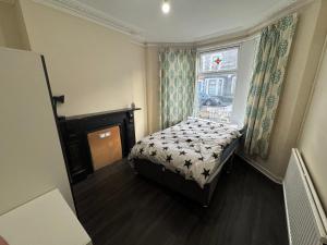 Ένα ή περισσότερα κρεβάτια σε δωμάτιο στο Guest House Albany Road