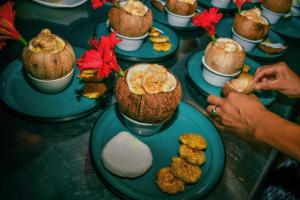 a table topped with plates of food on plates at El Campito Lodge in Ayampe +41 photos