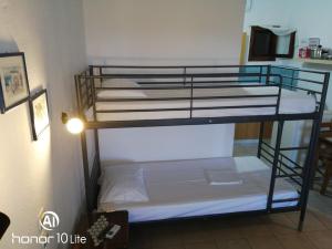 a couple of bunk beds in a room at Avra Ηouse in Kriopigi