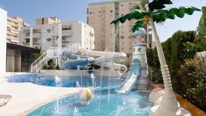 a water park with a water slide and a water slide at Hotel RH Arena - Todo Incluido in Gandía