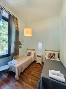 A bed or beds in a room at Affittacamere Firenze in Libertà Parterre