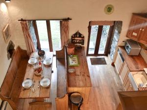 an overhead view of a wooden table in a kitchen at Ty Christian in Blaencelyn