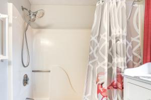 a shower in a bathroom with a shower curtain at Cape Cod Condo on the National Seashore Bike Path! in Provincetown
