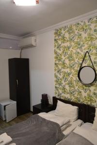 Postel nebo postele na pokoji v ubytování Nino's Hotel On Tsamebuli