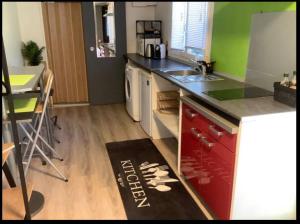 a kitchen with a sink and a counter top at Studio indépendant proche Aix en Provence avec jacuzzi in La Barben