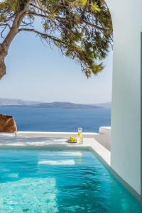 a swimming pool with a view of the ocean at Amazing Santorini Villa 1 Bedroom Pina Caldera Villa Astounding Caldera Views & Private Plunge Pool Oia in Oia