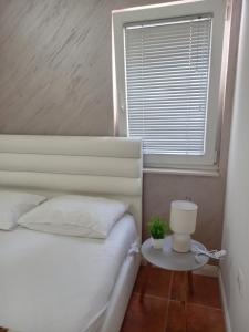 Postel nebo postele na pokoji v ubytování Vila Lazovic