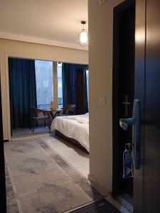 Ένα ή περισσότερα κρεβάτια σε δωμάτιο στο Pyramids Way Inn