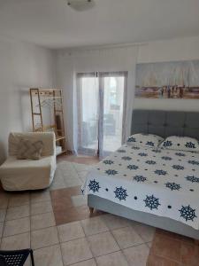 Postel nebo postele na pokoji v ubytování Apartmani Tolić