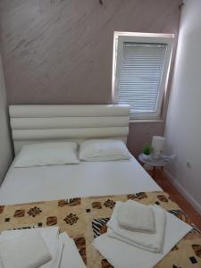 Postel nebo postele na pokoji v ubytování Vila Lazovic