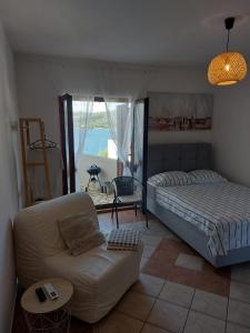 Postel nebo postele na pokoji v ubytování Apartmani Tolić