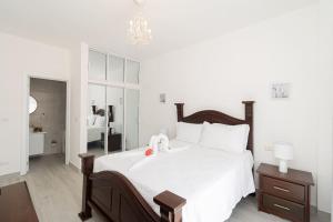 Ένα ή περισσότερα κρεβάτια σε δωμάτιο στο Bright 2BR Apartment with Pool near Bayahibe Beach +55 φωτογραφίες