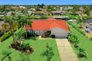 an aerial view of a house with an orange roof at Villa Camelot - Gulf Access in Shell Point Village