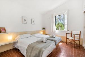 Ένα ή περισσότερα κρεβάτια σε δωμάτιο στο Sa Calma where the sea begins +21 φωτογραφίες