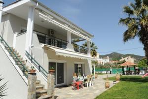 a villa with a view of the ocean at Nautilus 1st floor in Iraklitsa
