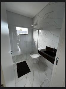 Koupelna v ubytování Residencial Violetas + 9 fotografií