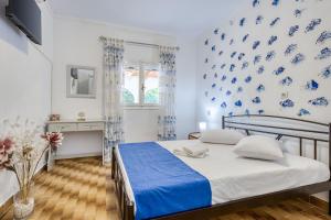 Ένα ή περισσότερα κρεβάτια σε δωμάτιο στο Villa Rossa - Hideaway by the sea
