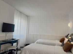 Postel nebo postele na pokoji v ubytování Hotel Agur