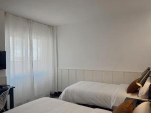 Postel nebo postele na pokoji v ubytování Hotel Agur