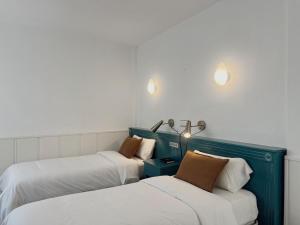 Postel nebo postele na pokoji v ubytování Hotel Agur