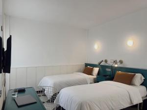 Postel nebo postele na pokoji v ubytování Hotel Agur