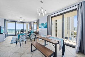 a living room with a view of the ocean at Pelican Pointe 506 in Orange Beach