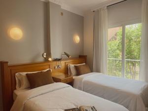Postel nebo postele na pokoji v ubytování Hotel Agur