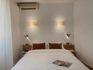 Postel nebo postele na pokoji v ubytování Hotel Agur