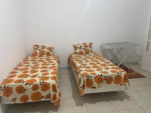 Postel nebo postele na pokoji v ubytování Appartement de vacances à Béni Khiar pour familles seulement